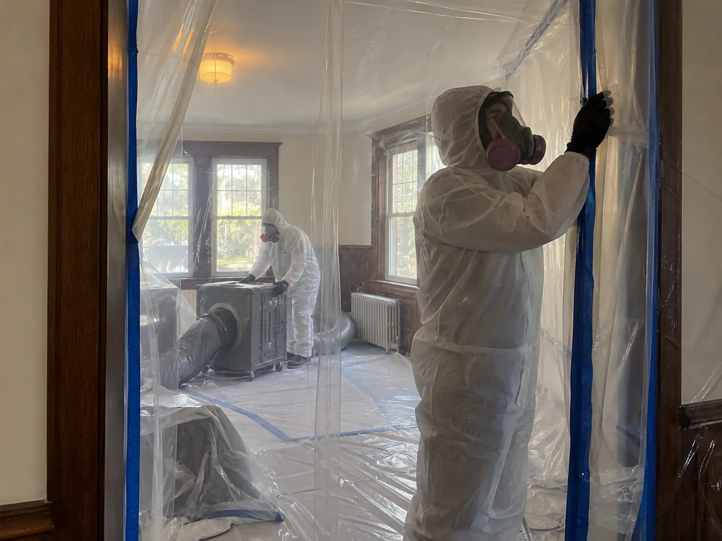 Containment check during a residential renovation with suspected asbestos materials